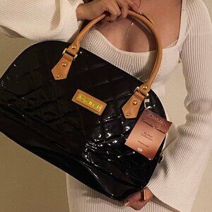 Joy and IMAN bag